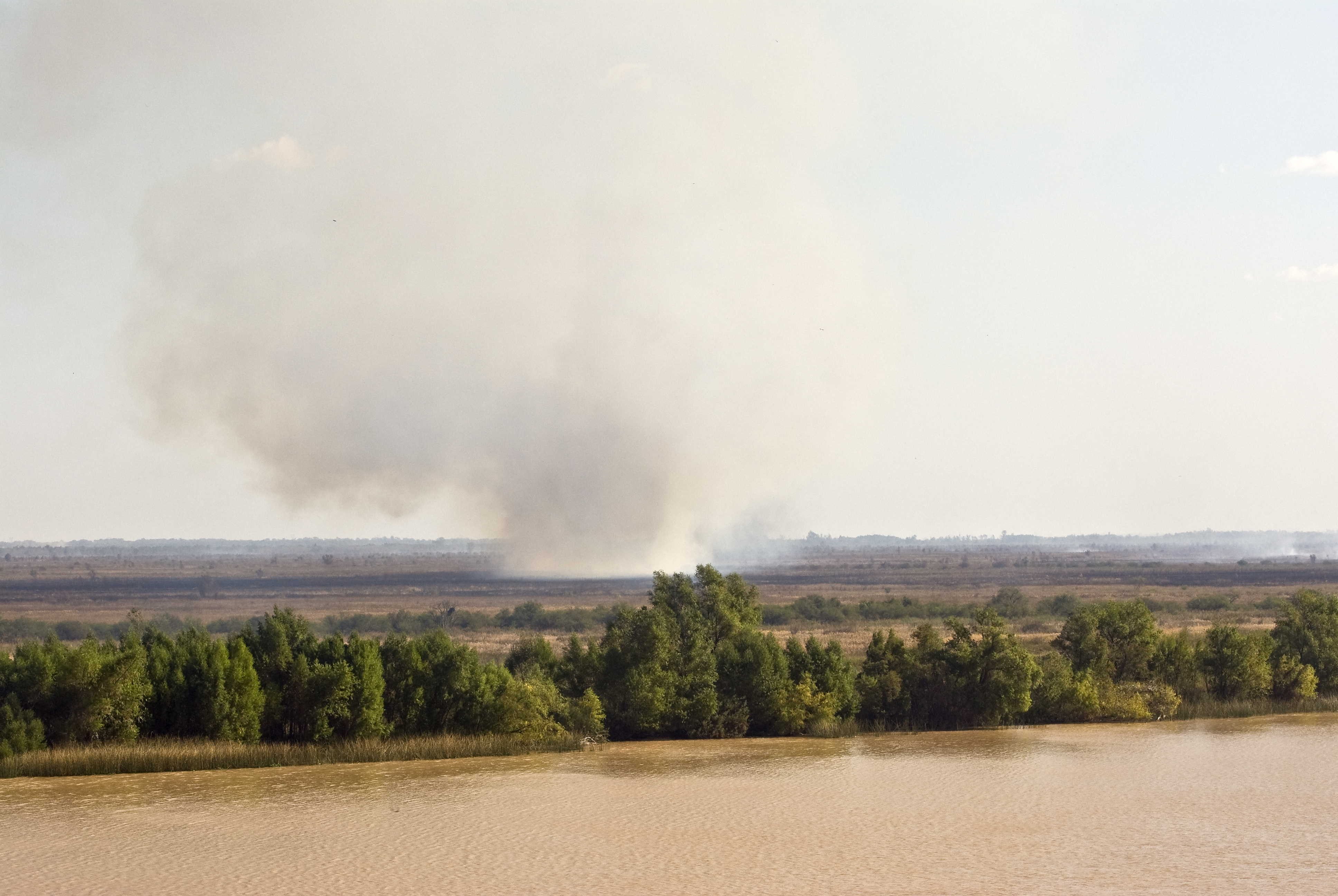 Upriver transit, fields burning — Argentina, 2008