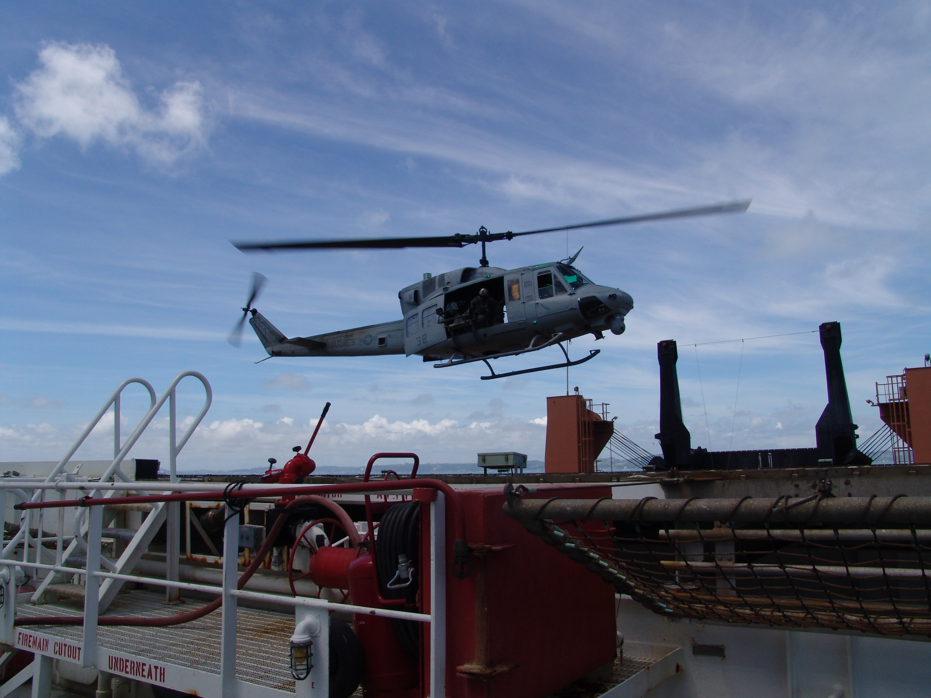 Huey helicopter on deck aboard the S/S Major Stephen W. Pless